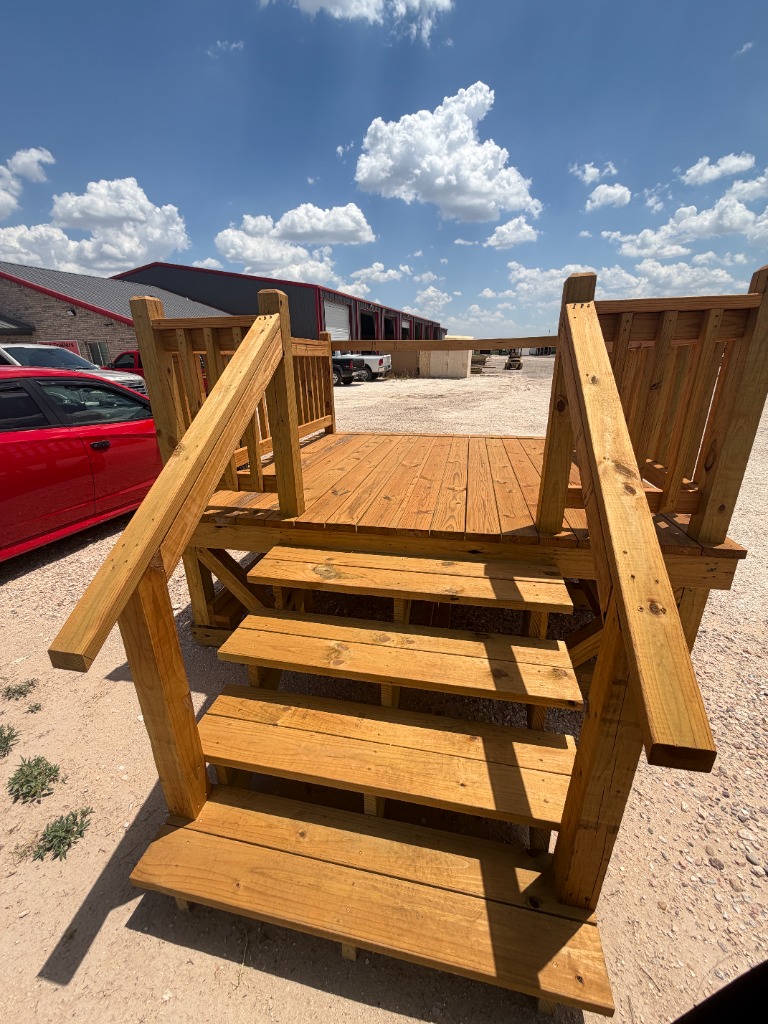 Custom deck with wide stairs and railings